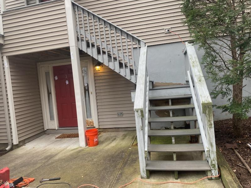 Exterior Back Porch Wooden Staircase to Red Door